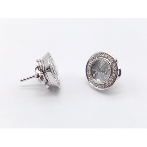 143 - A PAIR OF 18CT WHITE GOLD AND DIAMOND EARRINGS. ITALIAN DESIGN. 8.4gms