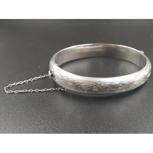 217 - A VINTAGE SILVER BANGLE WITH HINGE AND SAFETY CHAIN IN ORIGINAL BOX  16.1gms