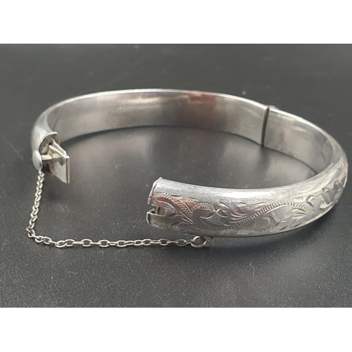 217 - A VINTAGE SILVER BANGLE WITH HINGE AND SAFETY CHAIN IN ORIGINAL BOX  16.1gms