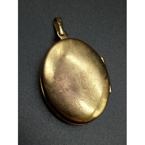 508 - 9CT GOLD OVAL PATTERENED LOCKET 4.2G