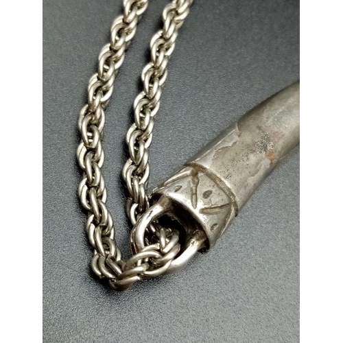 643 - White metal claw pendant on chain, weight 43g chain 72cm long and pendant 7cm drop approx