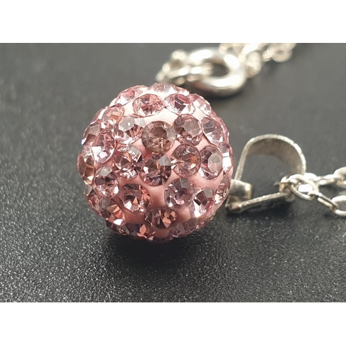 720 - Sterling silver pink crystal ball pendant on 18