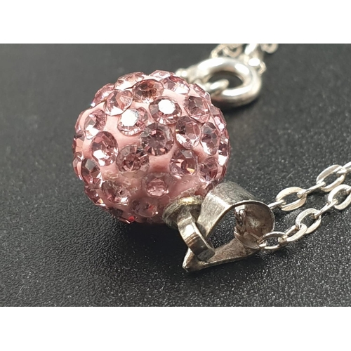 720 - Sterling silver pink crystal ball pendant on 18