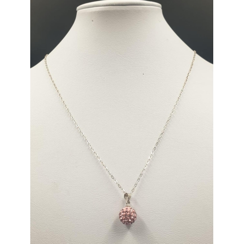 720 - Sterling silver pink crystal ball pendant on 18