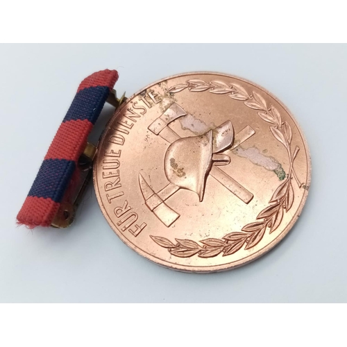 721 - Fur Treue Dienste German medal of 10 year faithful service Bronze medal fire brigade circa 1959