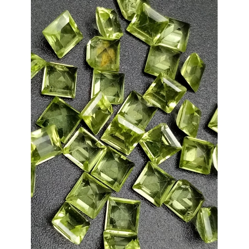 787 - Parcel of 32 square cut peridots total weight 10.65cts