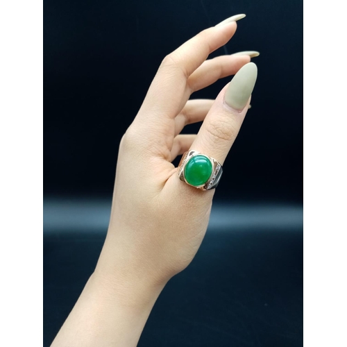 797 - 18ct Gold ring with natural jade stone and diamond shoulders. 16.2g total weight and size R.