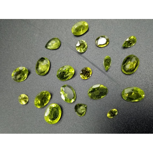 815 - A parcel of 18 assorted size cut peridots total weight 15.06cts