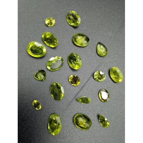 815 - A parcel of 18 assorted size cut peridots total weight 15.06cts