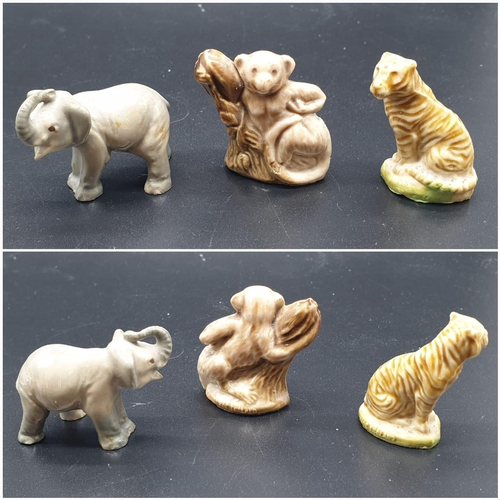 909 - A Selection of 10 ceramic miniature Wade animal figurines.