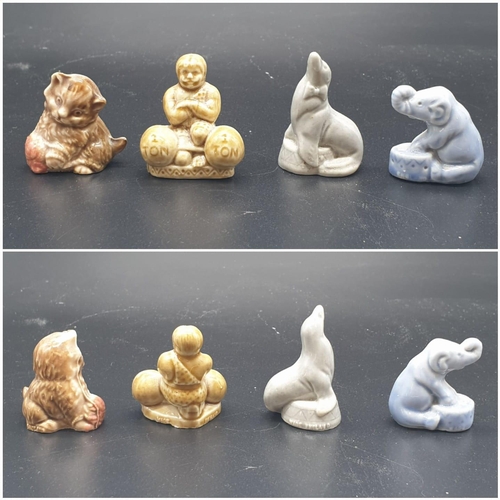 909 - A Selection of 10 ceramic miniature Wade animal figurines.