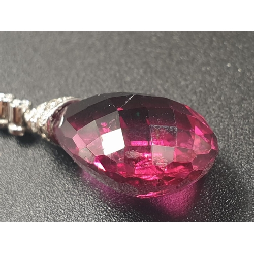 125 - a pair of 18ct white gold earrings with diamonds and a 6.5cm DROP TO NICELY CUT PINK TOURMALINE STON... 