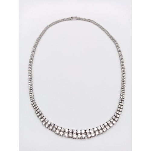 246 - Platinum Diamond Set Necklace. Bright clear graduated stones. 27.3g total weight. 42cm length. 10.01... 