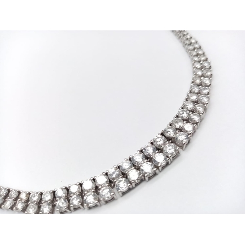 246 - Platinum Diamond Set Necklace. Bright clear graduated stones. 27.3g total weight. 42cm length. 10.01... 