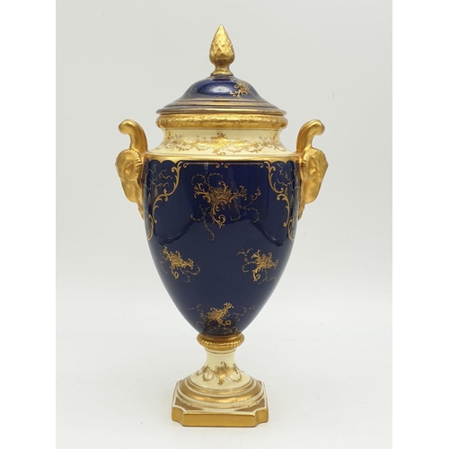 196 - A Coalport Porcelain Vase and Cover. Stunning Gilt and Cobalt Blue with a Hand-painted Scene of Duno... 