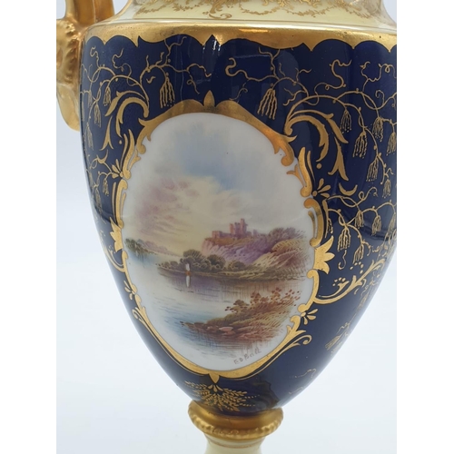 196 - A Coalport Porcelain Vase and Cover. Stunning Gilt and Cobalt Blue with a Hand-painted Scene of Duno... 