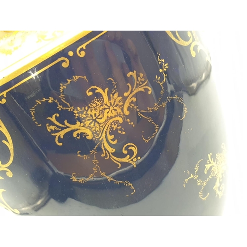 196 - A Coalport Porcelain Vase and Cover. Stunning Gilt and Cobalt Blue with a Hand-painted Scene of Duno... 