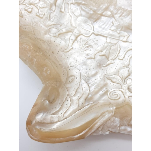 91 - An Antique Chinese Mother Of Pearl Shell. Deep Carved with a Warrior Scene. 17 x 20cm