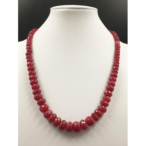 175 - A 220cts single row Africa ruby necklace with a sterling silver ruby and peridot gemstone clasp 47cm