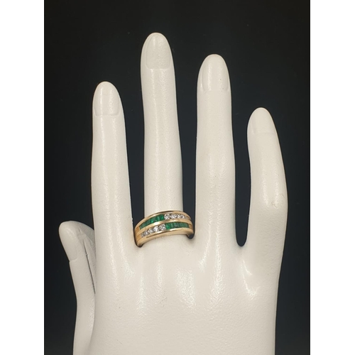 204 - 14K Gold Ring with Channel set Emeralds and Diamonds. 6.2g total weight. Size N.