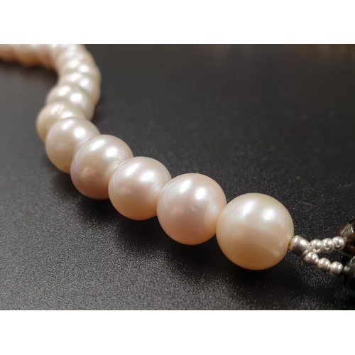 210 - 389cts Pearl and multigemstone necklace 57cm