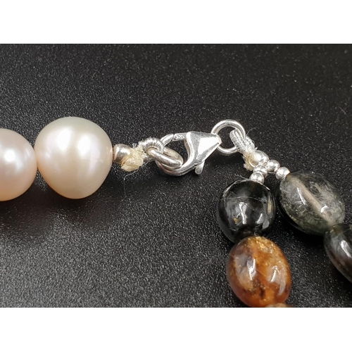 210 - 389cts Pearl and multigemstone necklace 57cm