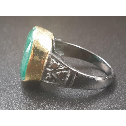 364 - 10ct emerald ring with rose cut diamonds, two tone finish, the emerald has been set in 9kt yellow go... 