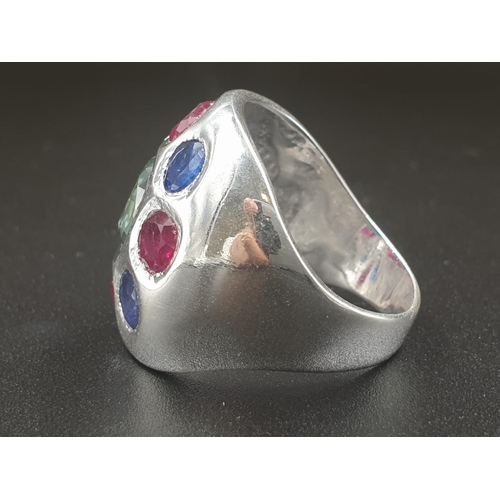 378 - A Cocktail ring with natural rubies and Blue sapphires and a flat blue moissanite in the center. Siz... 