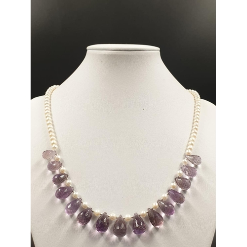 392 - A 4mm freshwater pearl necklace with Amethyst drops , sterling silver clasp