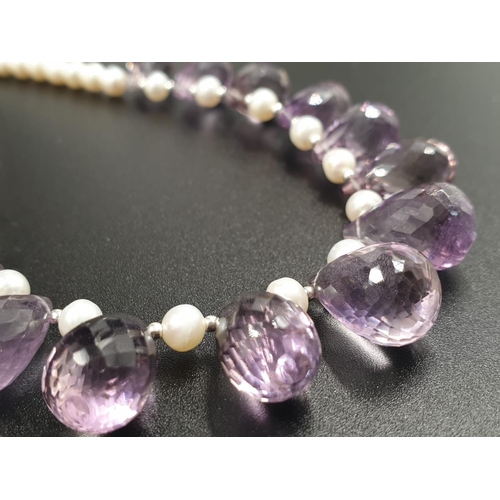 392 - A 4mm freshwater pearl necklace with Amethyst drops , sterling silver clasp