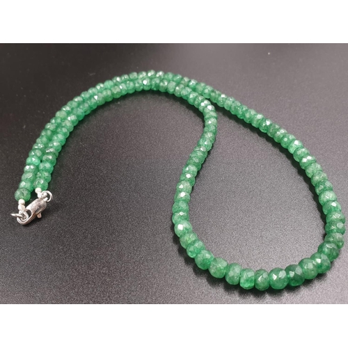 427 - A single row emerald gemstone necklace with matching dangler earrings