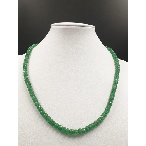 427 - A single row emerald gemstone necklace with matching dangler earrings