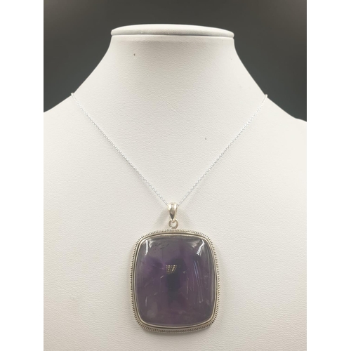 491 - A collection of cabochon Amethyst gemstone pendant and bracelet