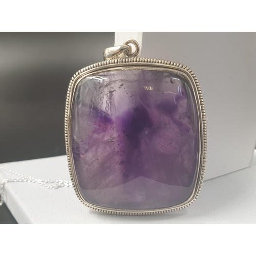 491 - A collection of cabochon Amethyst gemstone pendant and bracelet