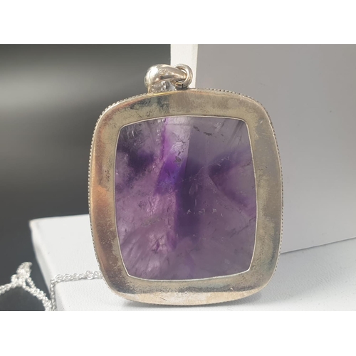 491 - A collection of cabochon Amethyst gemstone pendant and bracelet