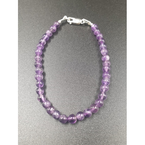 491 - A collection of cabochon Amethyst gemstone pendant and bracelet