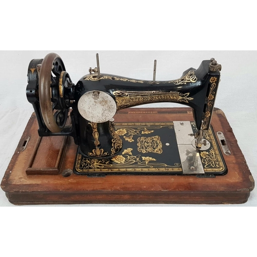 198 - A FINELY DECORATED ANTIQUE SEWING MACHINE IN WOODEN CARRYING CASE MADE BY FRISTER AND ROSSMAN CICA 1... 