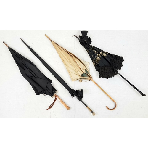 421 - A Selection of 4 Antique/Vintage Umbrellas. All in working order, including a Victorian mourning Par... 