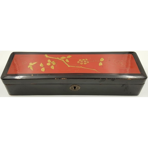 439 - A Vintage Chinese Domino Set in a Lacquered Box, with Floral Gilded Decoration on Lid. 28 x 8cm.