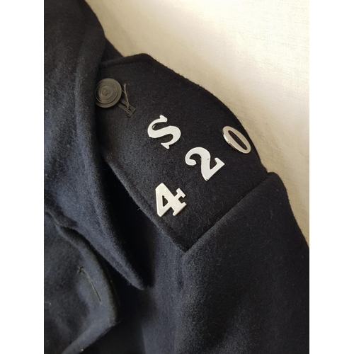 94 - A  1960'S METROPOLITAN POLICE GREAT COAT WITH ORIGINAL INSIGNIA.