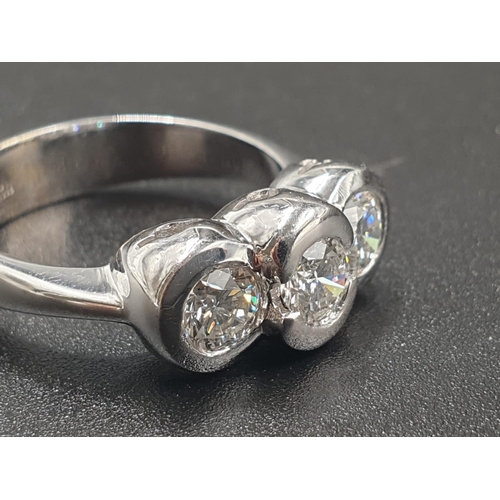 333 - AN 18CT WHITE GOLD RING WITH A TRILOGY OF DIAMONDS OF OVER 1CT. 6.7gms SIZE O