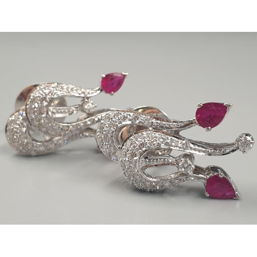 370 - A PAIR OF 18CT WHITE GOLD EARRINGS WITH RUBY AND DIAMONDS.
11.5gms