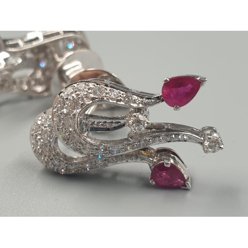 370 - A PAIR OF 18CT WHITE GOLD EARRINGS WITH RUBY AND DIAMONDS.
11.5gms