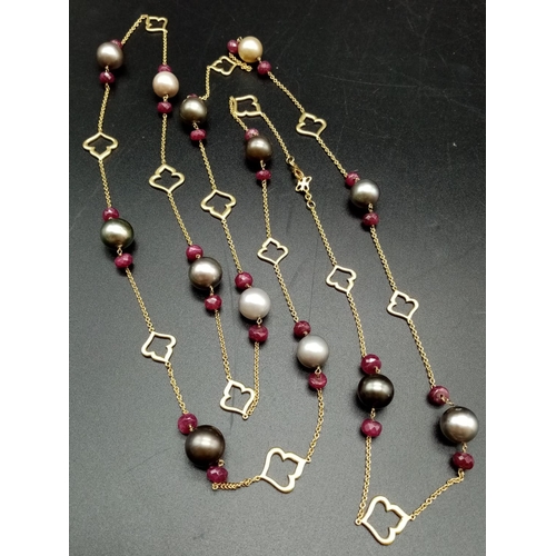 533 - AN 18CT GOLD NECKLACE WITH RUBY AND TAHITION PEARLS MEASURING 125 cms IN LENGTH AND WEIGHING 55.6 gm... 