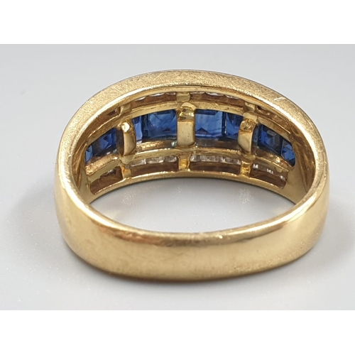 543 - AN 18CT GOLD RING WITH CHANNEL SET DIAMONDS AND SAPHIRES 7.4gms SIZE N