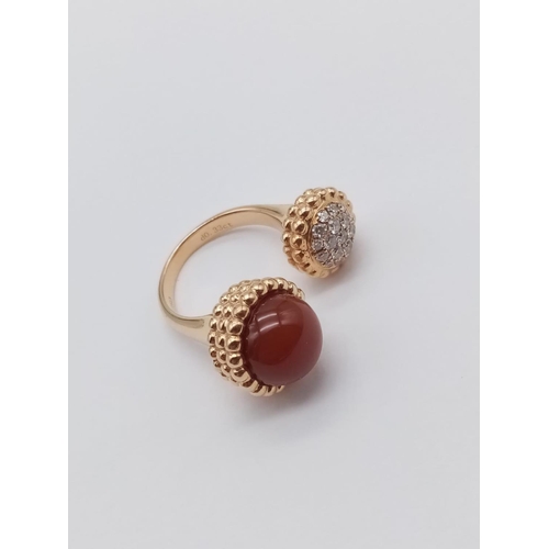 557 - AN UNUSUAL DOUBLE FACED DRESS RING IN 18CT ROSE GOLD WITH CARNELIAN AND DIAMONDS.
FITS ANY SIZE   9.... 