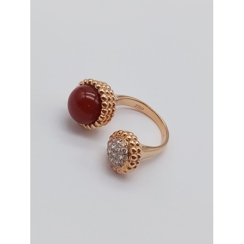 557 - AN UNUSUAL DOUBLE FACED DRESS RING IN 18CT ROSE GOLD WITH CARNELIAN AND DIAMONDS.
FITS ANY SIZE   9.... 