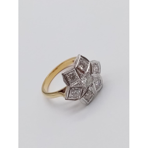 571 - AN 18ct GOLD RING WITH 1.08CT OF BRILLIANT DIAMONDS FORMING A PRETTY FLORAL EFFECT.
6.00gms   SIZE O