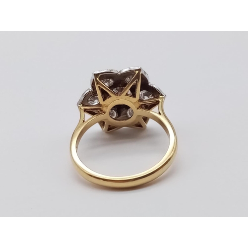 571 - AN 18ct GOLD RING WITH 1.08CT OF BRILLIANT DIAMONDS FORMING A PRETTY FLORAL EFFECT.
6.00gms   SIZE O