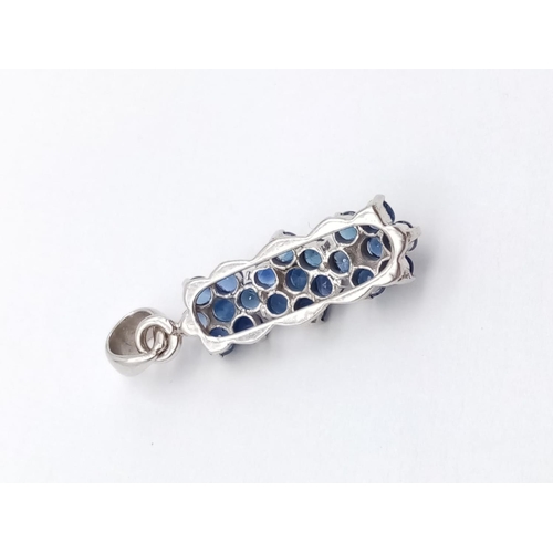 582 - 18CT WHITE GOLD SAPPHIRE SET PENDANT, WEIGHT 2.3G